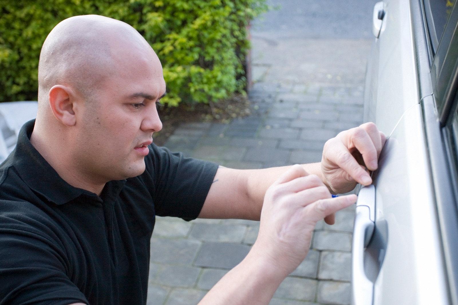 West Salem car locksmith technician from Affordable Car Keys working on a vehicle