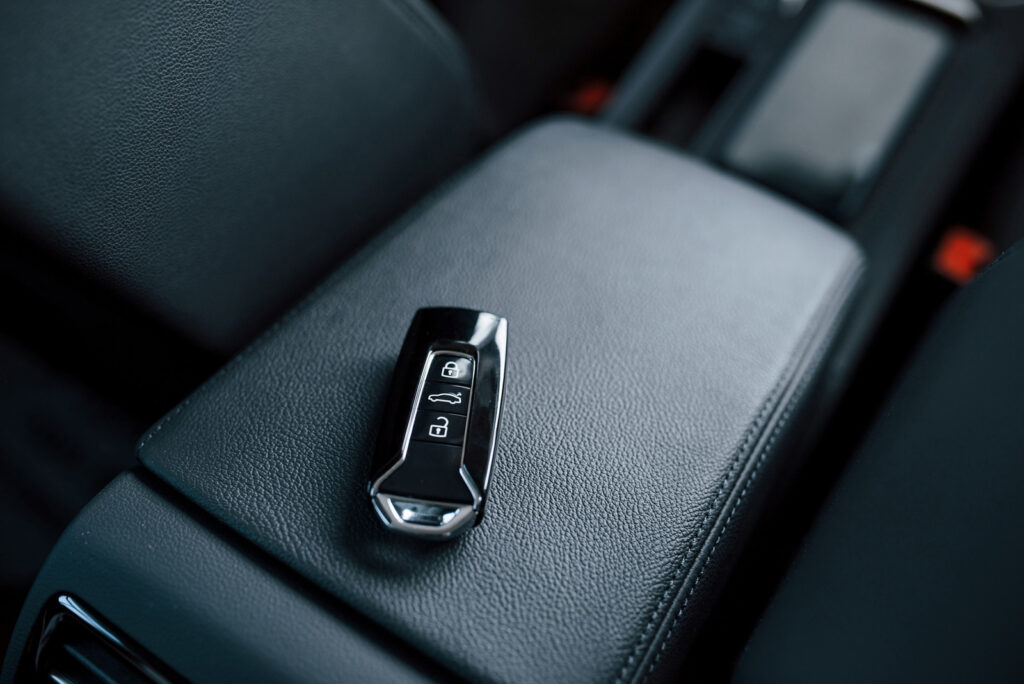 Car key fob sitting on car's center console