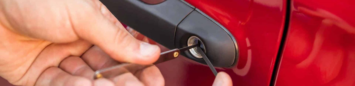 Technician unlocking a vehicle door during a car lockout service in Winston-Salem, North Carolina by Affordable Car Keys